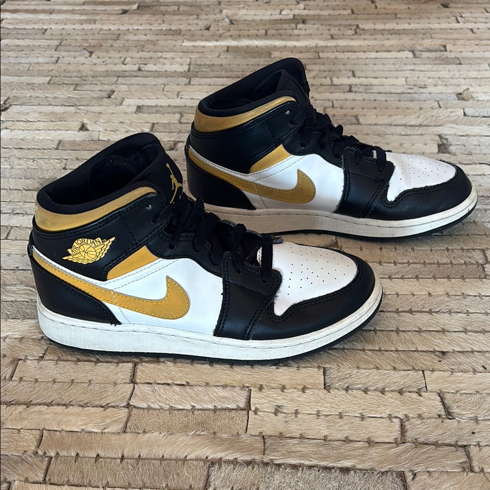 Nike Jordan’s Black and Gold Sneakers